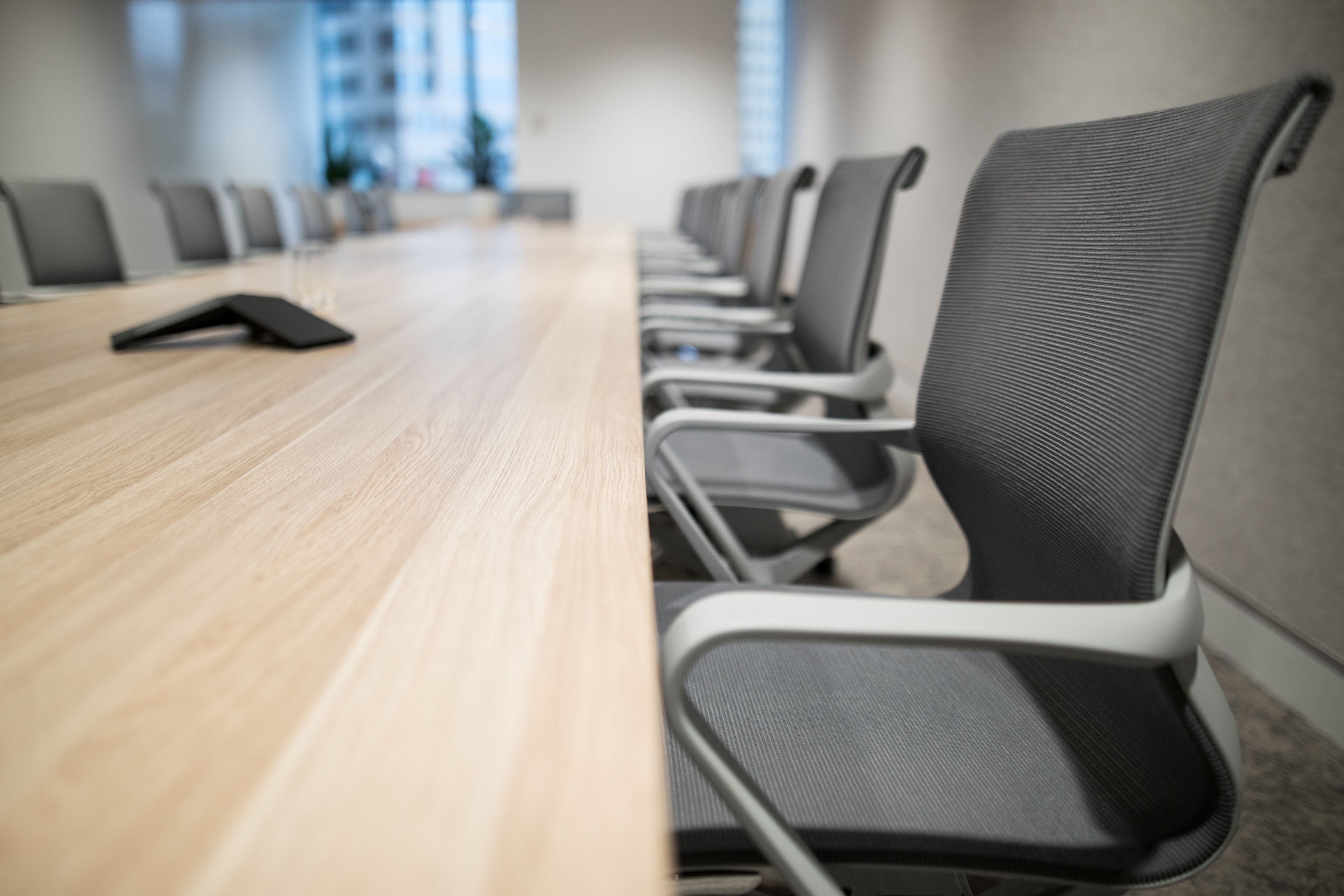 Professional office furniture installation team assembling workstations in modern office
